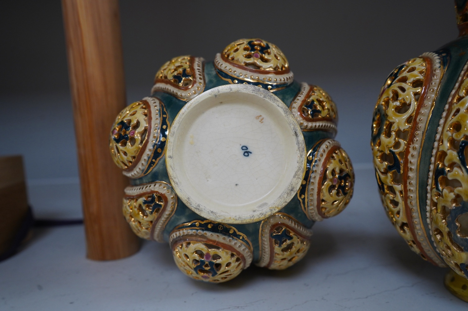 A pair of Zsolnay, Hungarian double walled reticulated vases, 29cm high. Condition - some restoration